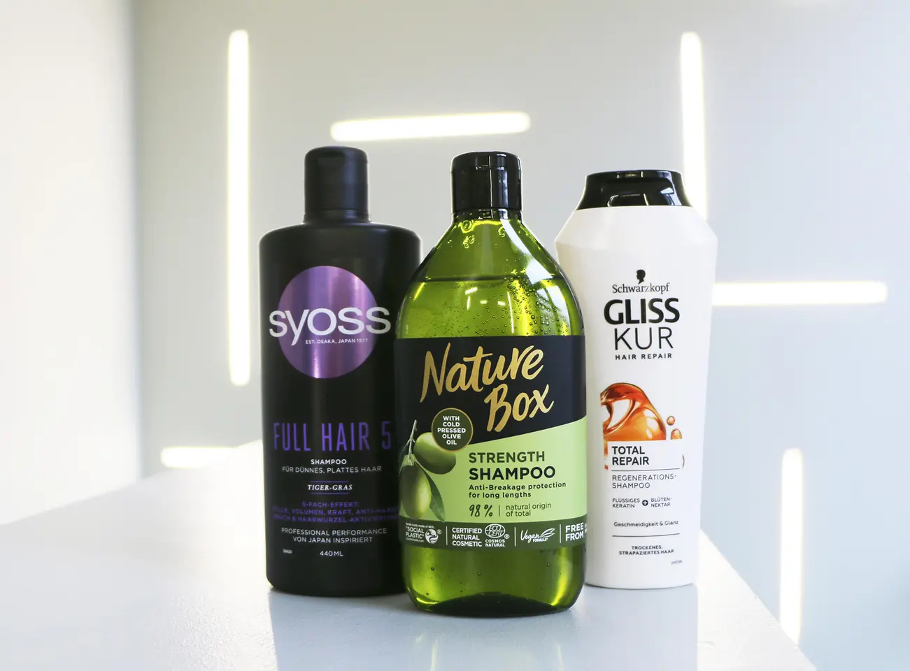 Shampoo packaging of Syoss, Nature Box and Gliss Kur 