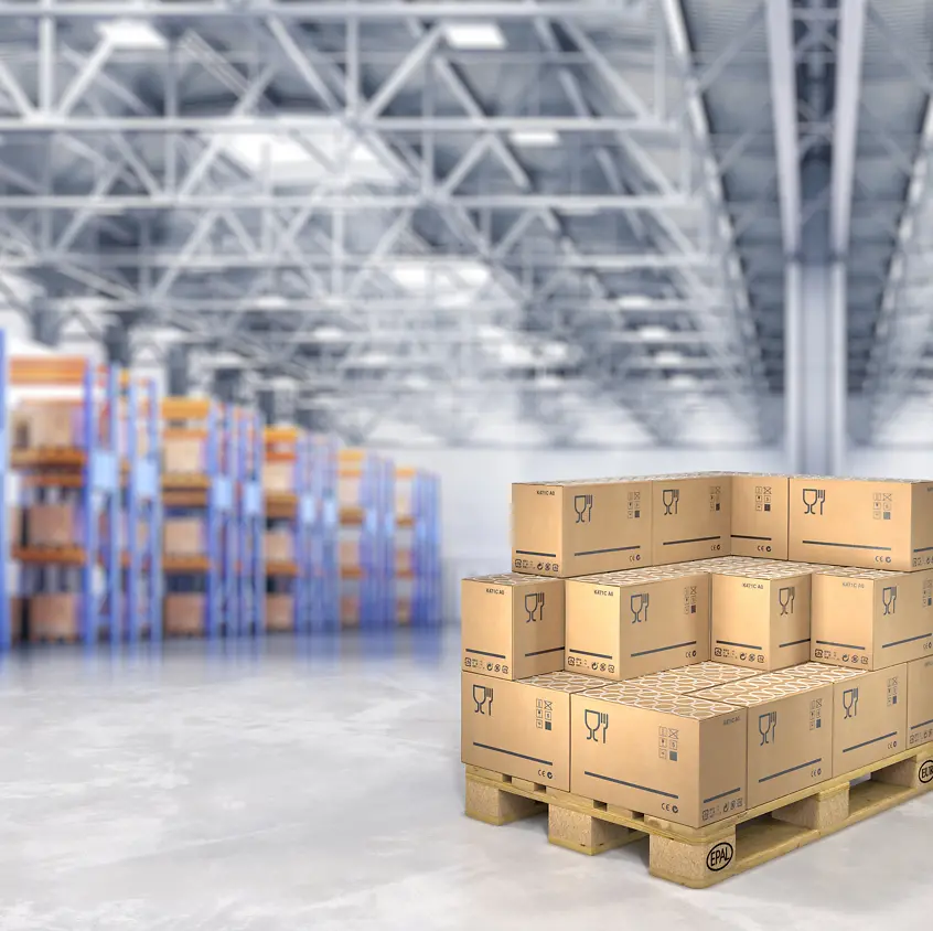 Stacked boxes on a pallet in a warehouse.