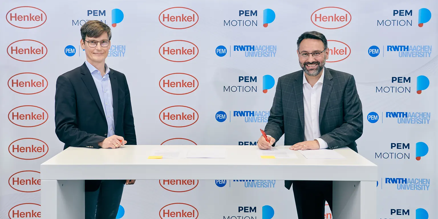 Professor Achim Kampker, Chair Holder and Partner at PEM (left), and George Kazantzis, Corporate Vice President Adhesive Technologies, Automotive Components, Henkel (right)