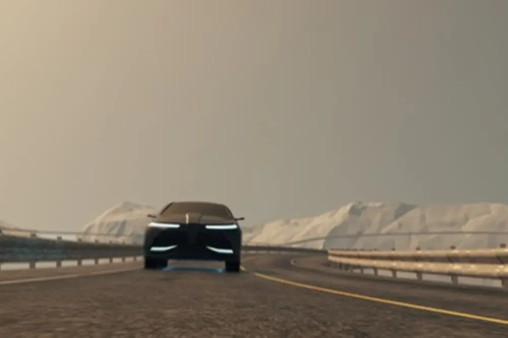 Car driving on a street with snowy mountains in the back